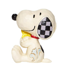 Enesco figurine Snoopy étreint Woodstock posée sur un bureau ajoutant chaleur décorative