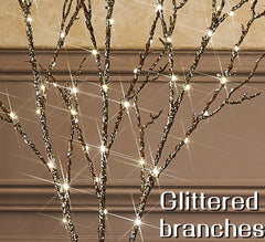 Fudios branches disposées en vase, éclairant un centre de table chaleureux