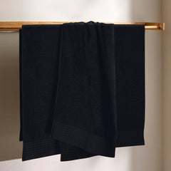 GLAMBURG serviette pliée démontrant compacité et facilité de rangement