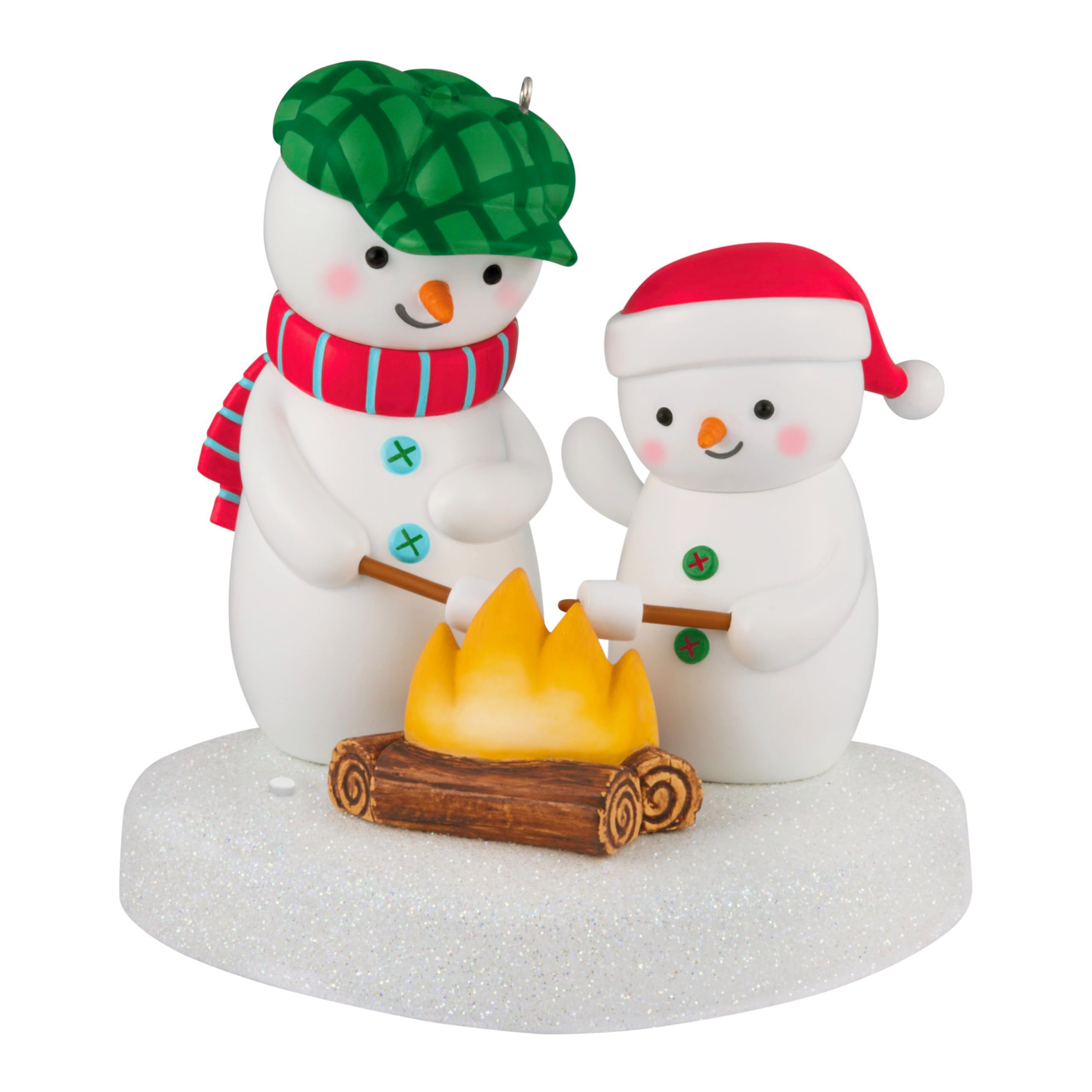 Hallmark bonhommes de neige devant feu, décor chaleureux et festif