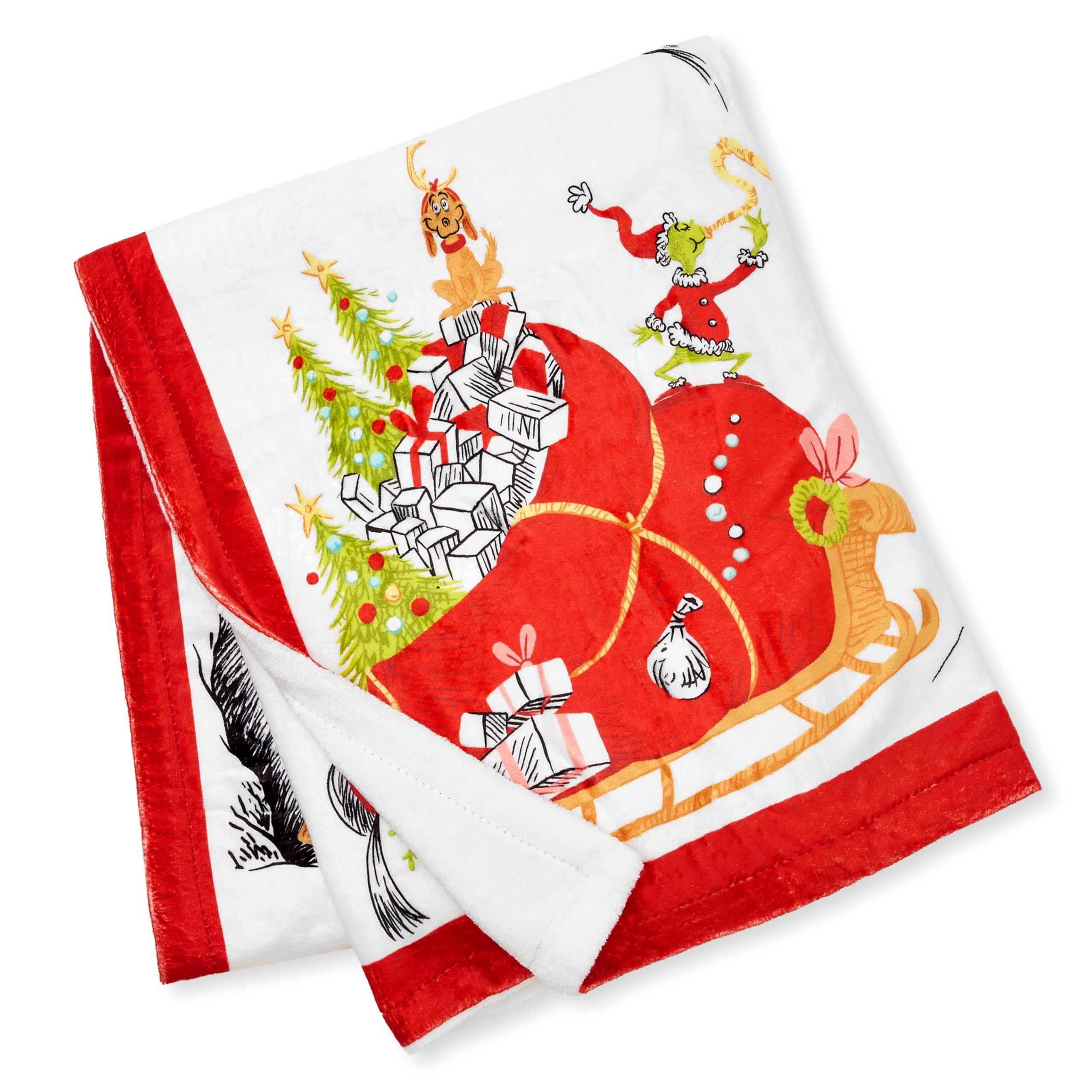 Hallmark couverture Grinch posée à côté d’un objet pour échelle