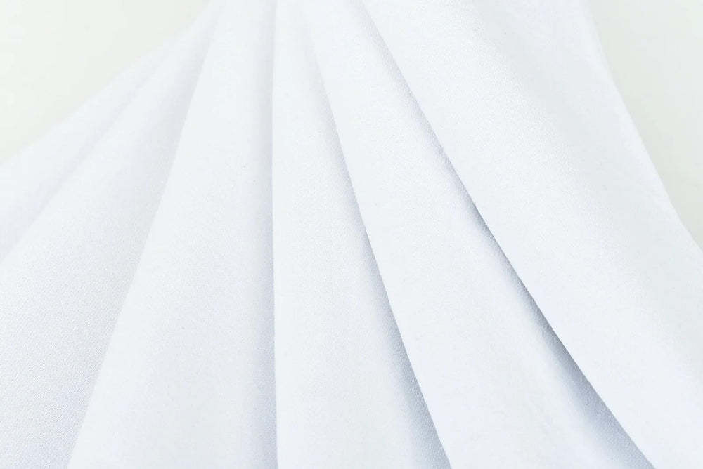 Serviette HAVLULAND pliée dans sac, design léger et facile à emporter