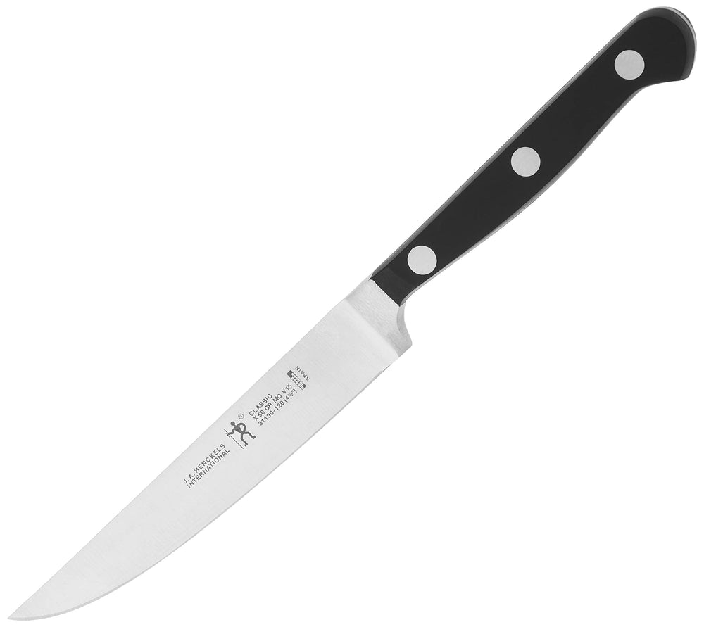 HENCKELS couteaux en usage sur table montrant coupes nettes lors d’un repas