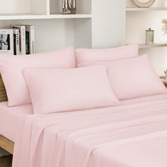 HOMEIDEAS ensemble plié rose pâle montrant présentation soignée et gain de place