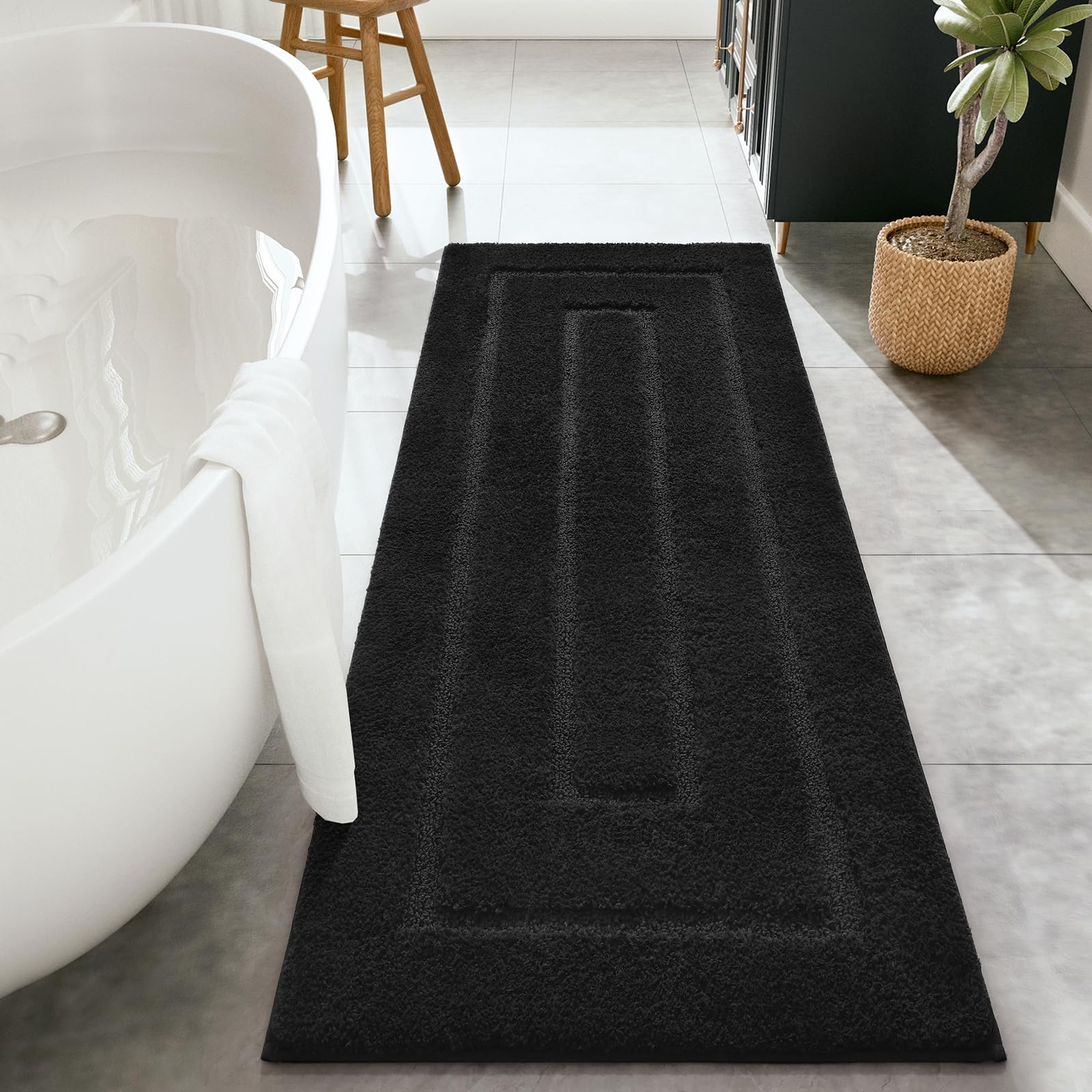 HOMORE tapis de bain face avant noir montrant design élégant et protection du sol