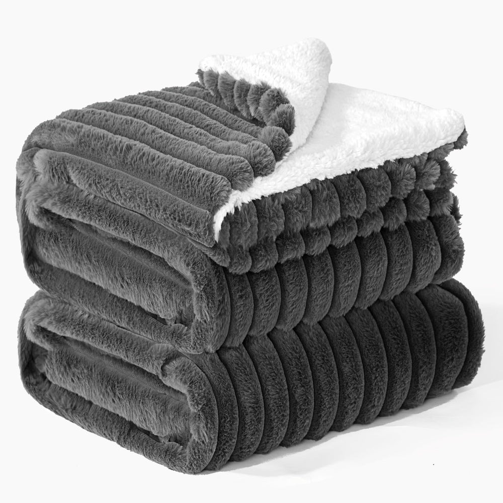 INFIIXSO plaid ouvert sur canapé montrant grande couverture et confort