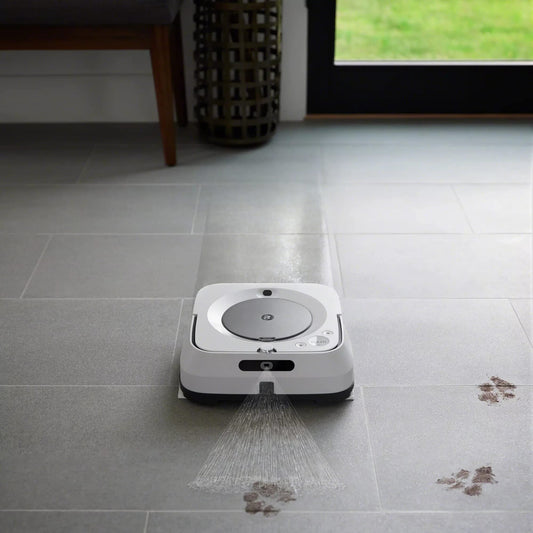 iRobot gros plan fibres capillaires montrant absorption efficace des saletés