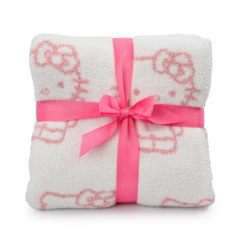 Jay Franco couverture posée sur canapé ajoutant touche Hello Kitty décorer la pièce