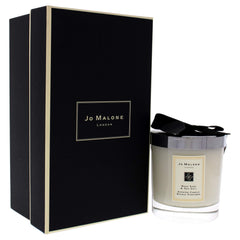 Jo Malone bougie allumée créant ambiance chaleureuse et relaxante