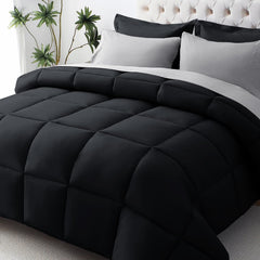JOLLYVOGUE couette noir et gris clair présenté sur lit, confort immédiat