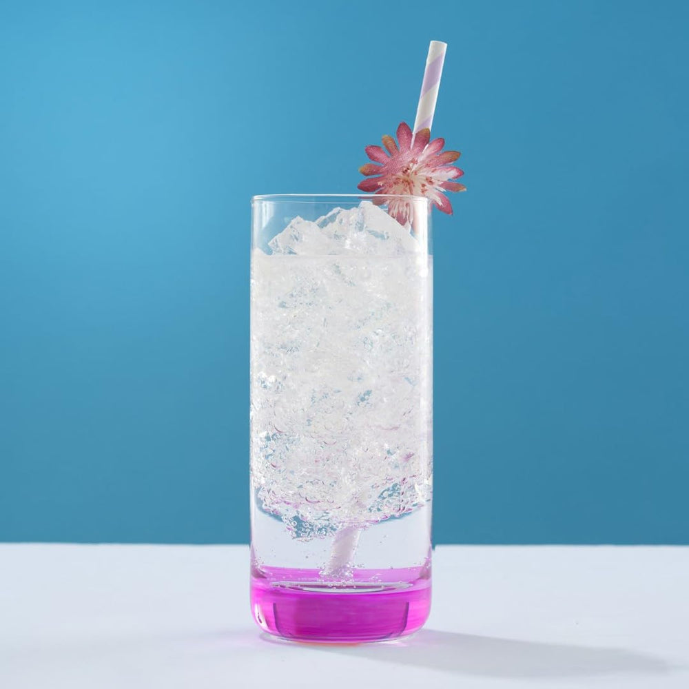 JoyJolt Hue à côté d'une bouteille pour comparaison de taille et capacité