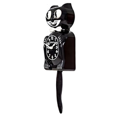 Kit Cat Klock queue en mouvement montrant dynamisme et caractère ludique