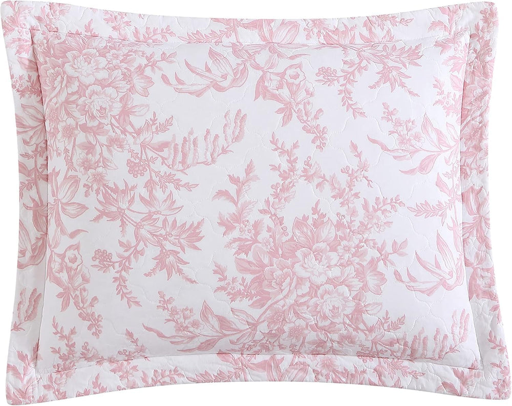 Laura Ashley couette posée sur lit queen montrant retombée et style