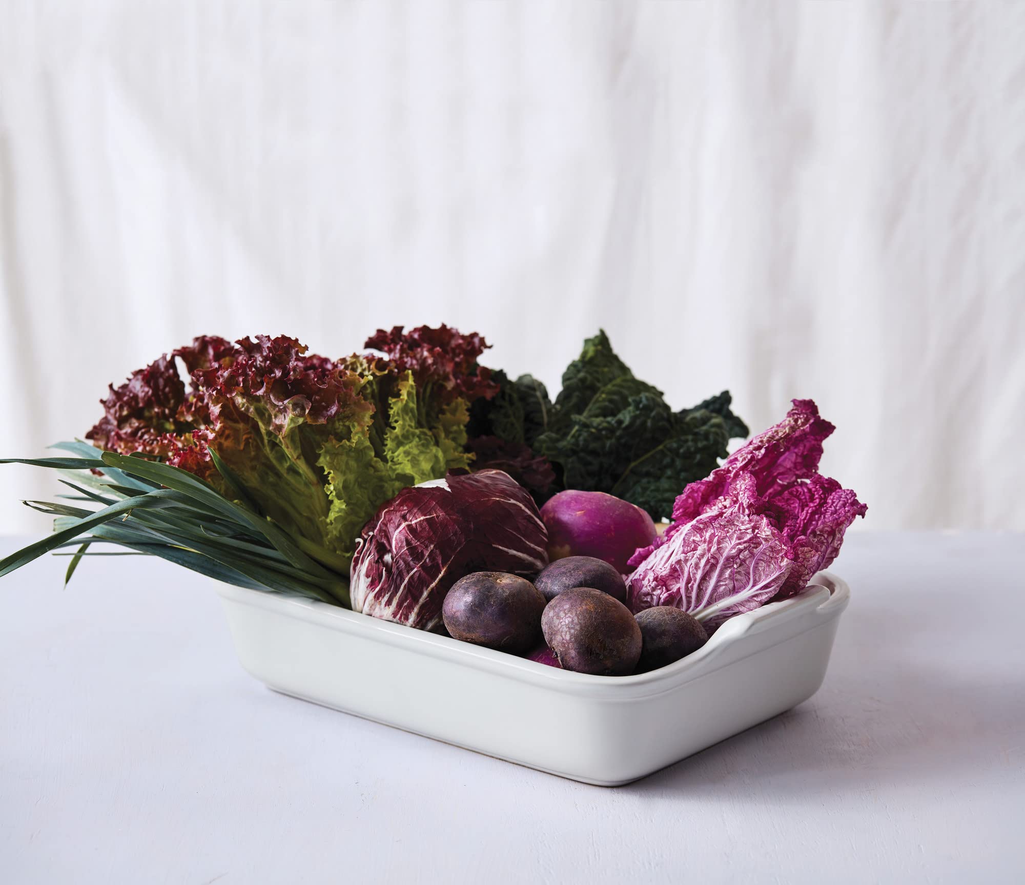 Le Creuset détail de l'étiquette et bord émaillé illustrant finition résistante et durable