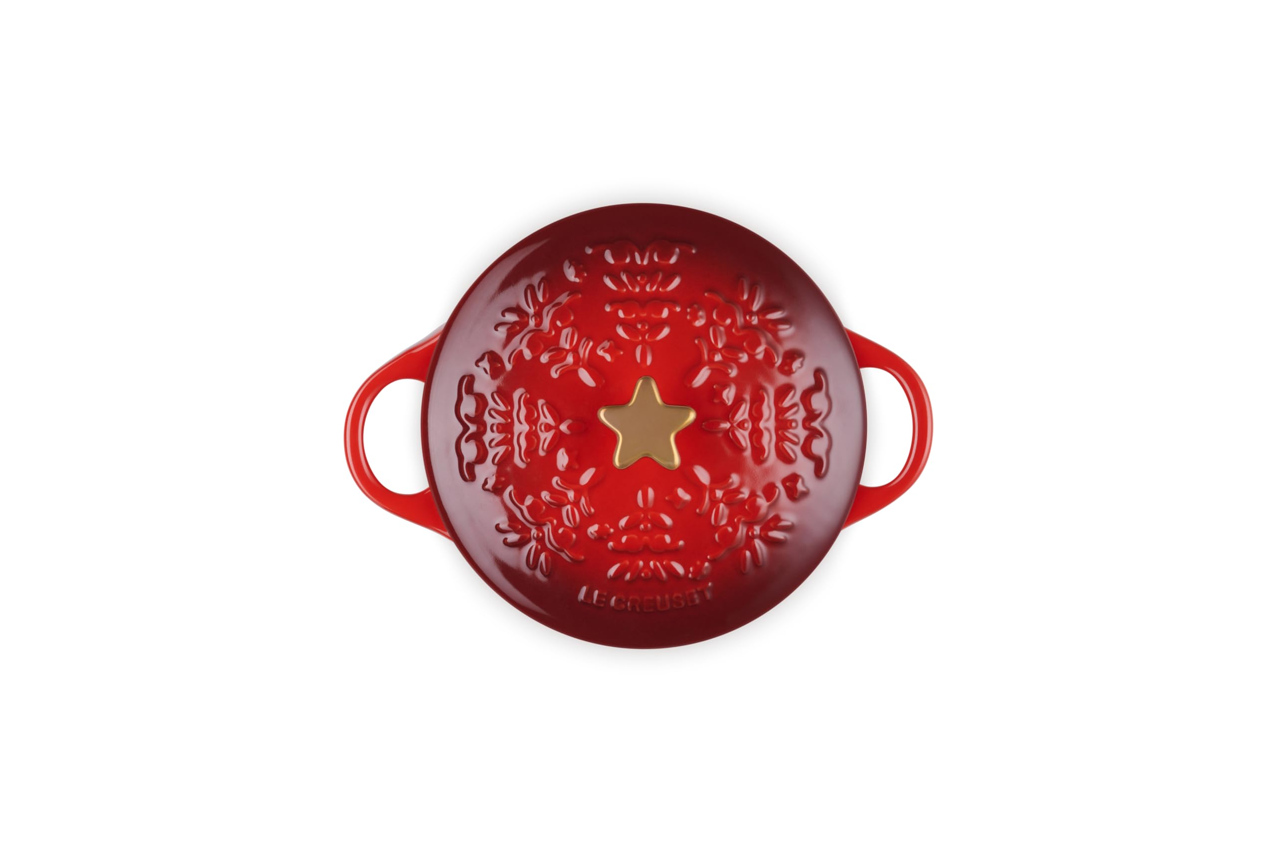 Le Creuset bouton étoile doré gros plan ajoutant élégance et finition festive