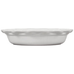 Le Creuset moule Heritage à l'échelle avec main pour taille et ergonomie