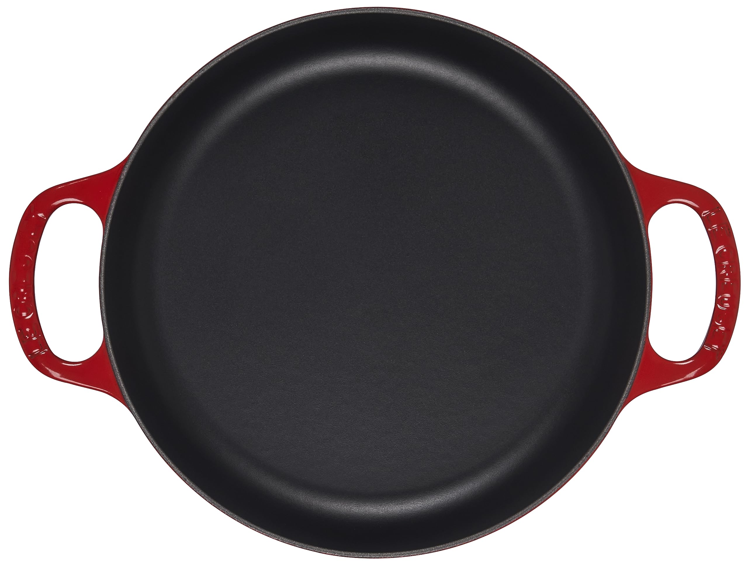 Le Creuset gros plan sur l'émail cerise montrant la finition résistante et brillante