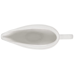 Le Creuset saucière en usage versant une sauce avec contrôle et sans gouttes