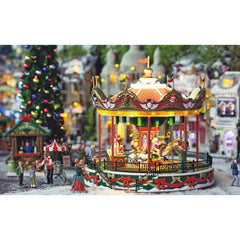 Lemax Santa Carousel en fonctionnement avec lumières et sons pour ambiance