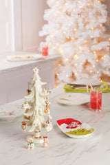 Lenox coupe Merry Grinchmas sur table de fête avec friandises pour accueil convivial