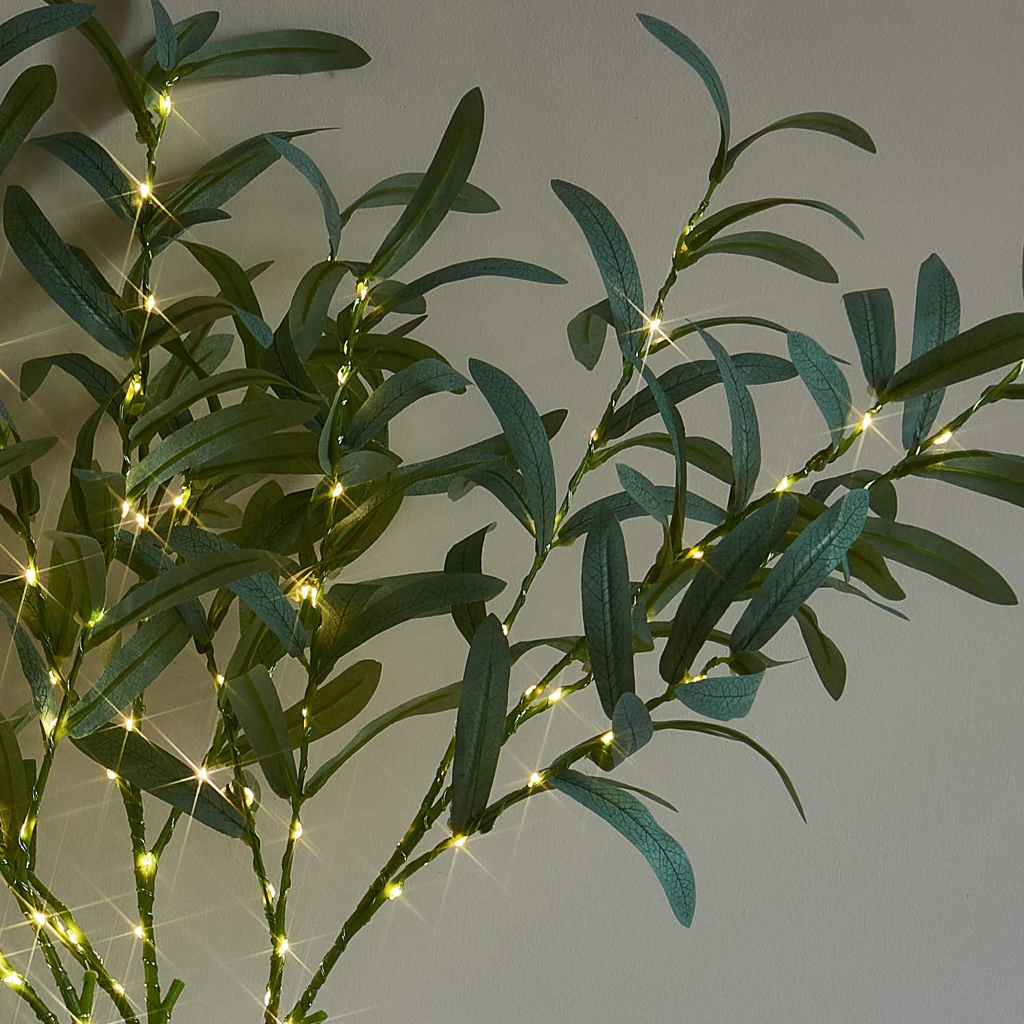 LITBLOOM branche placée dans un vase pour un centre de table raffiné
