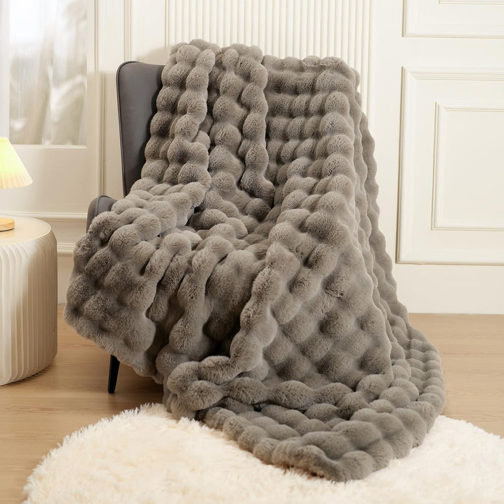 macinso plaid face avant sur canapé apportant chaleur et style