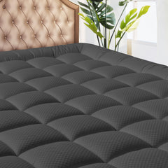 MATBEBY surmatelas devant emballé montrant protection et design