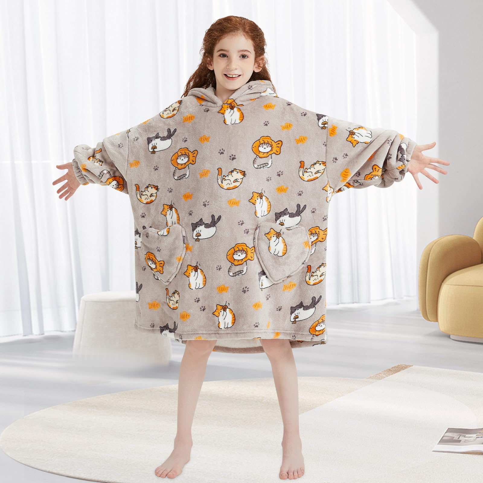 Mewkou hoodie comparaison taille sur enfant montrant ajustement oversize