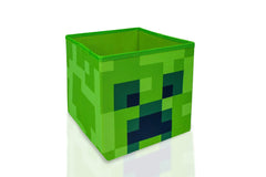 Minecraft Creeper face avant montrant le design iconique et apport décoratif