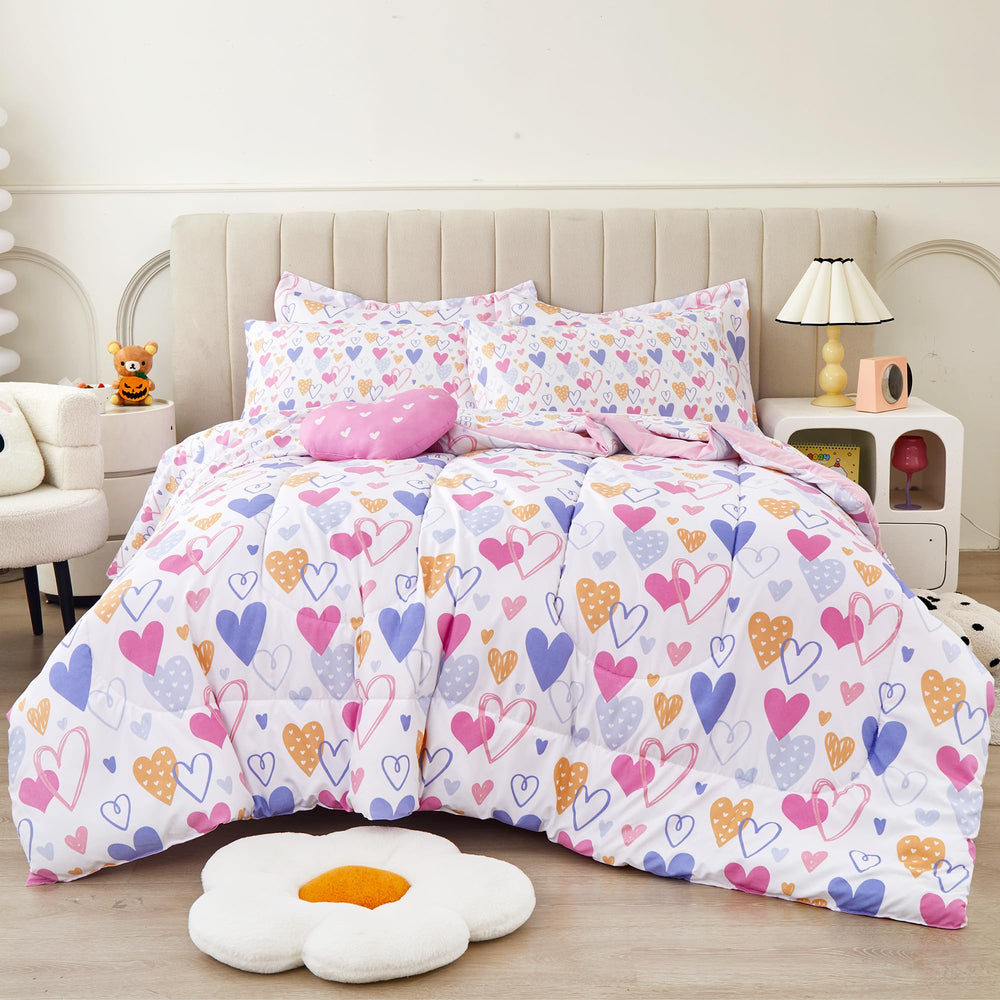 Mooreeke face avant de la couette rose à motifs cœurs apporte confort