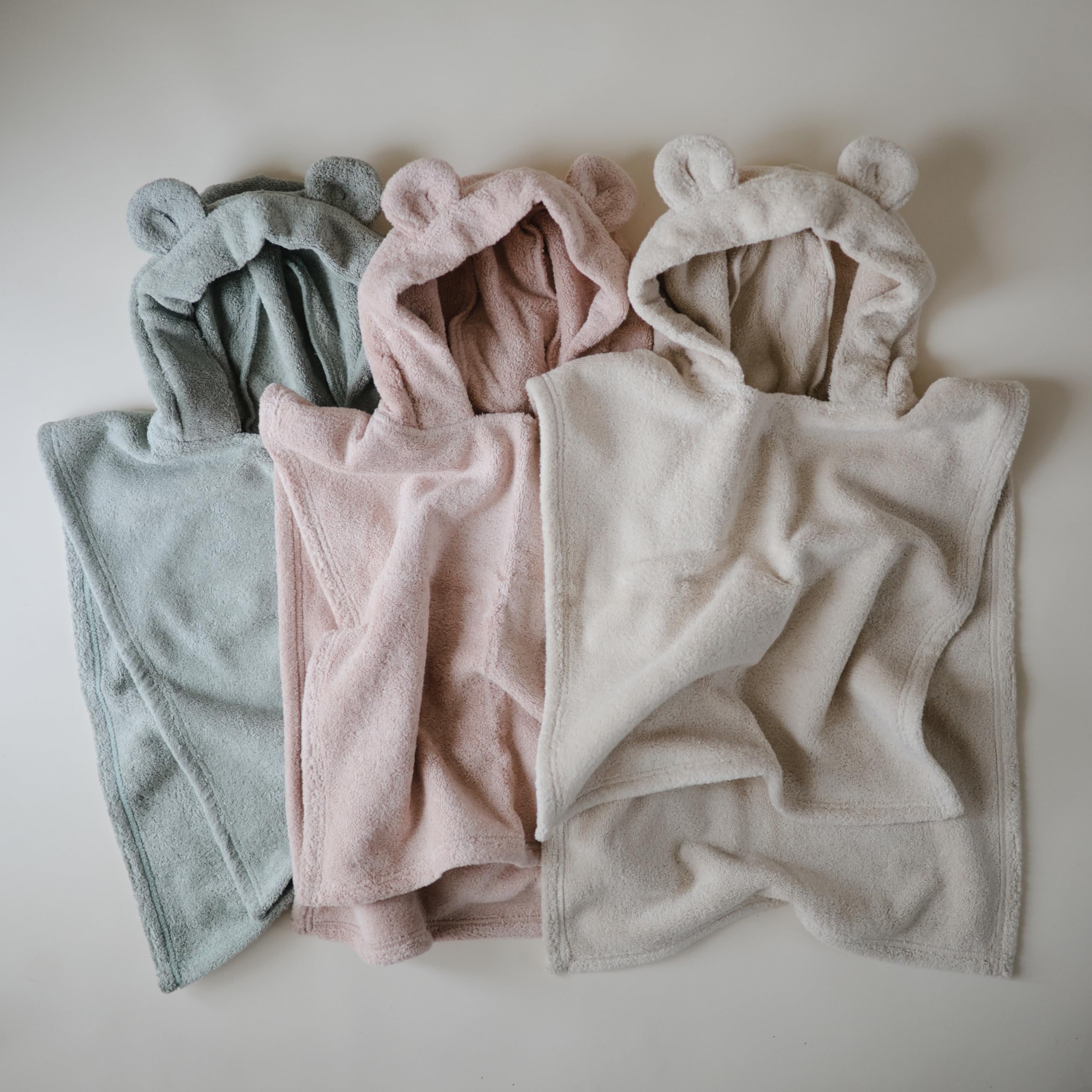 mushie poncho après lavage conservant douceur et absorption