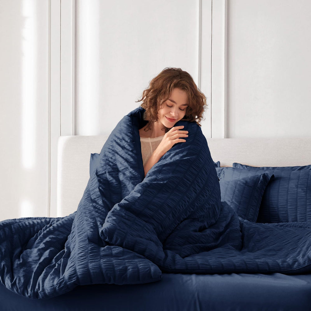 MUXHOMO zoom sur coutures renforcées montrant durabilité et résistance au lavage