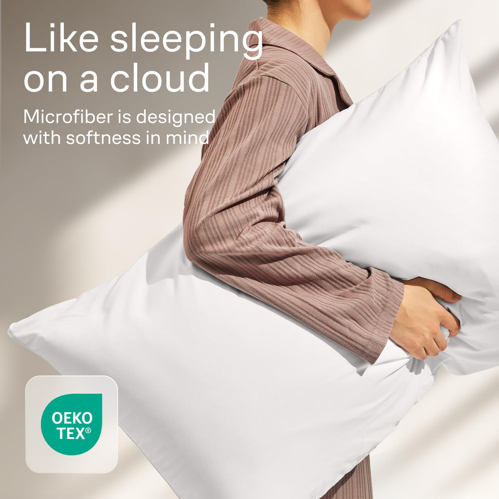 Niagara Sleep Solution lot de 8 posé sur lit King, rotation facile