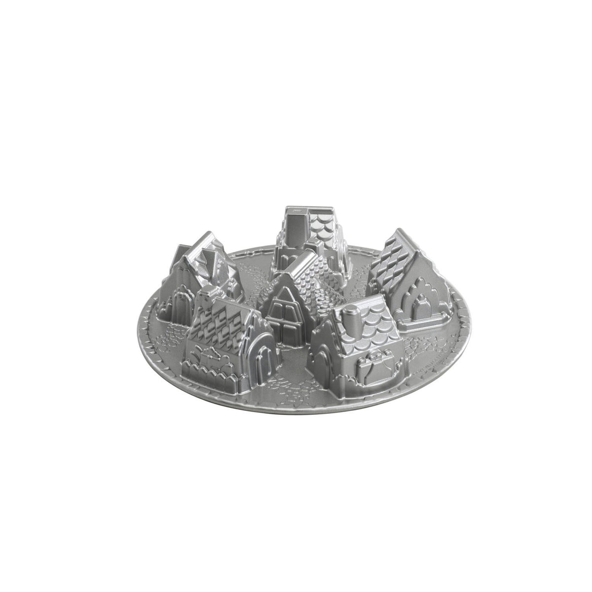 Nordic Ware moule Cozy Village vue avant emballage montrant six maisons, facilite créations festives