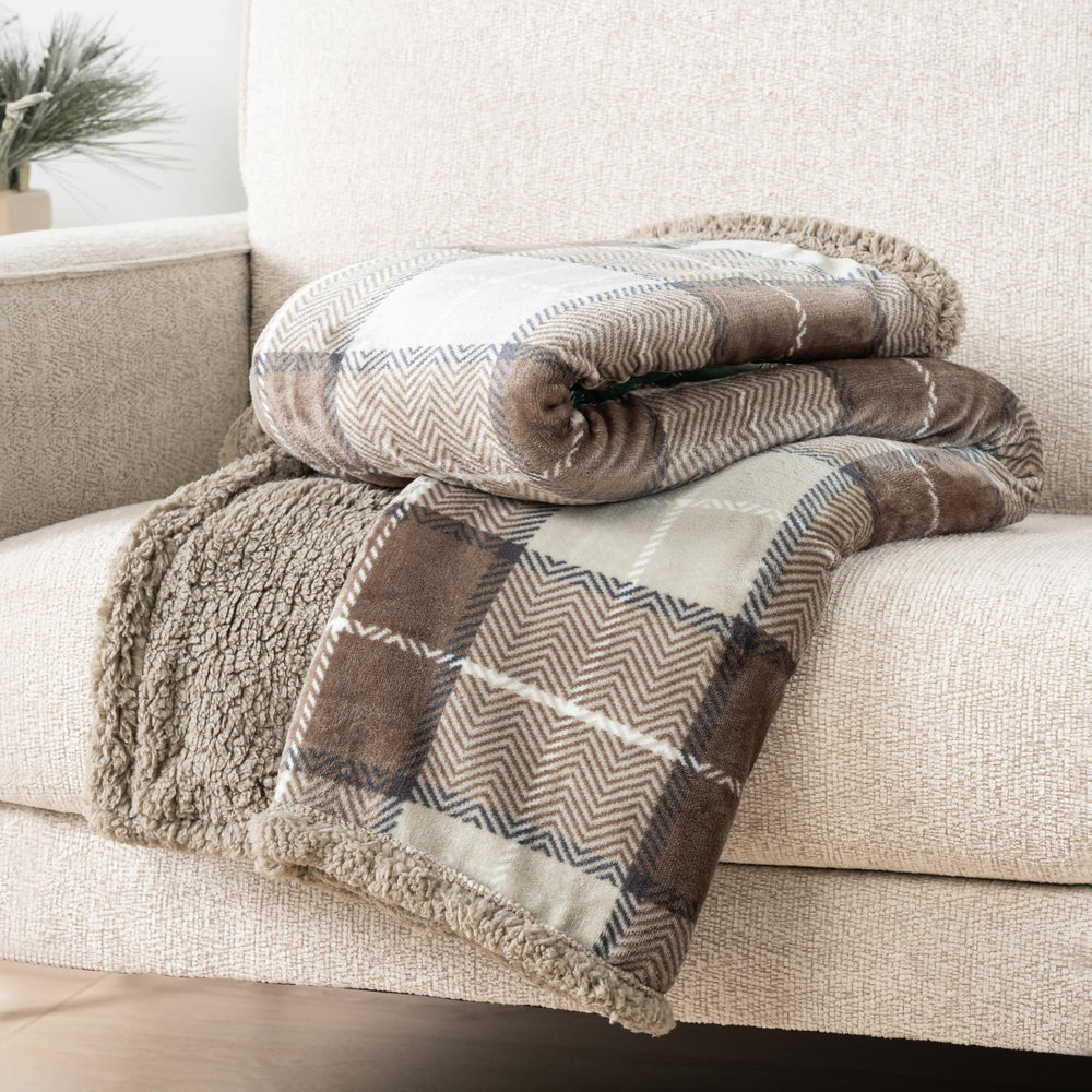 PAVILIA plaid plié montrant taille 60x80 pouces et rangement pratique
