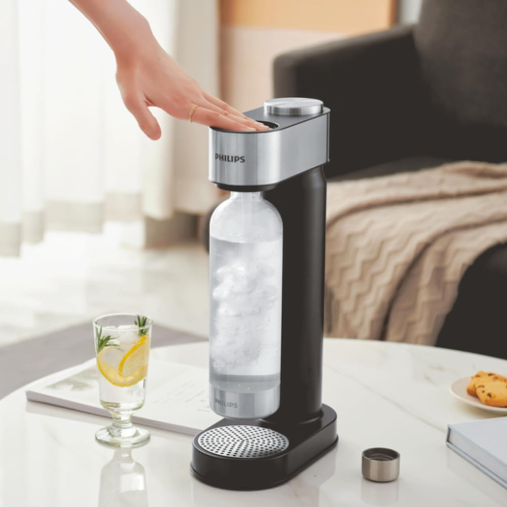PHILIPS bouteille insérée dans soda maker montrant facilité d'utilisation