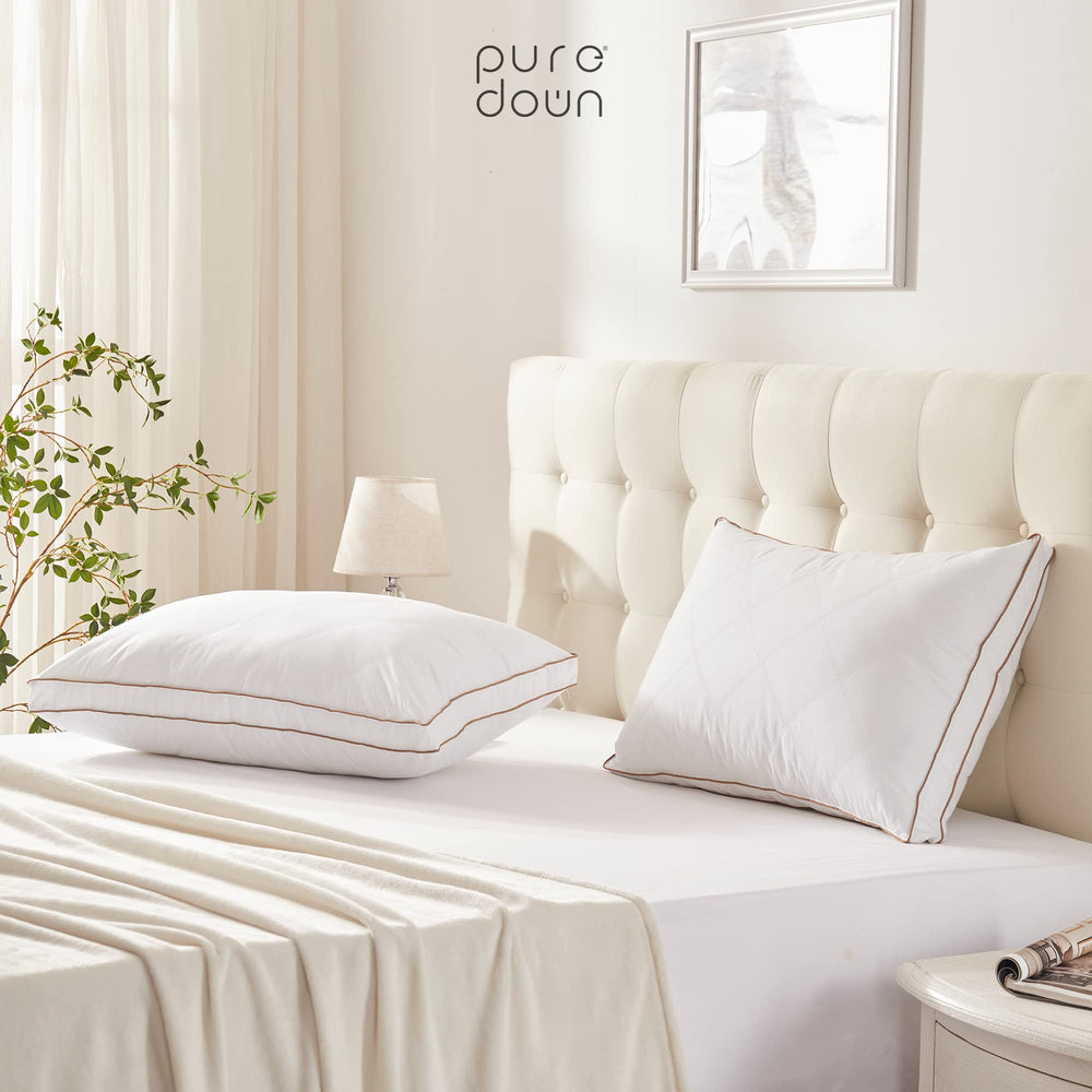 puredown deux oreillers posés sur un lit king style hôtelier accueillant