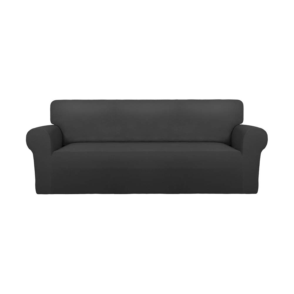 PureFit avant de la housse sur un canapé gris foncé montrant finition élégante