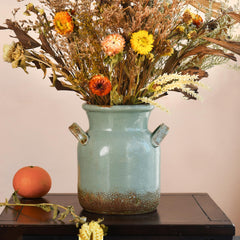 Quoowiit vase face avant montrant silhouette ronde et charme rustique