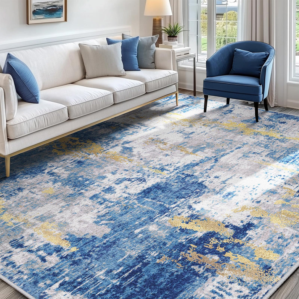 RELEANY face avant du tapis 5'x7' montrant le motif abstrait bleu et or, style moderne