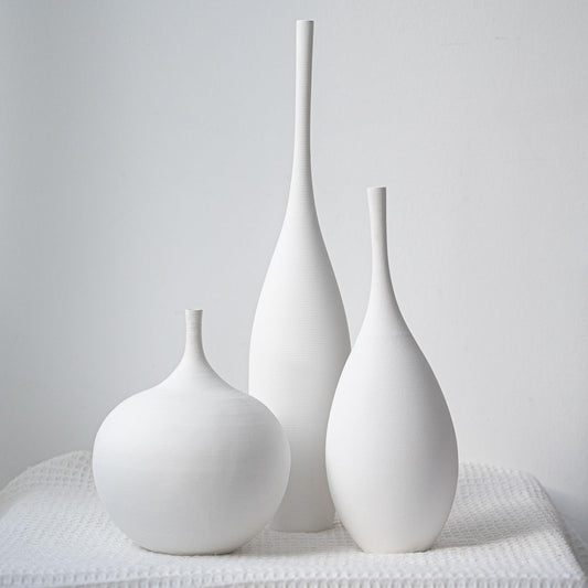 Relexome ensemble face montrant trois vases blancs pour décoration élégante