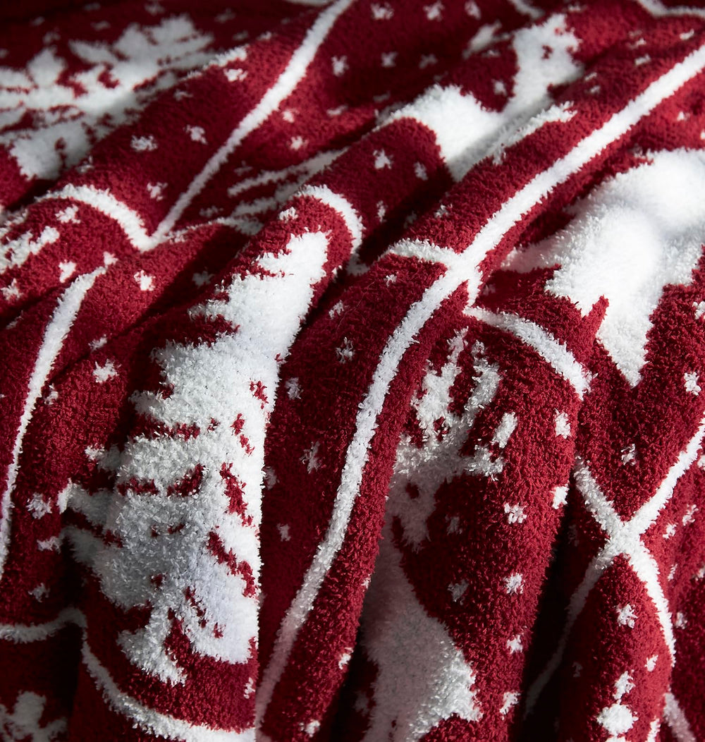 Détail motif sapin et cerf R.SHARE en rouge et blanc pour Noël