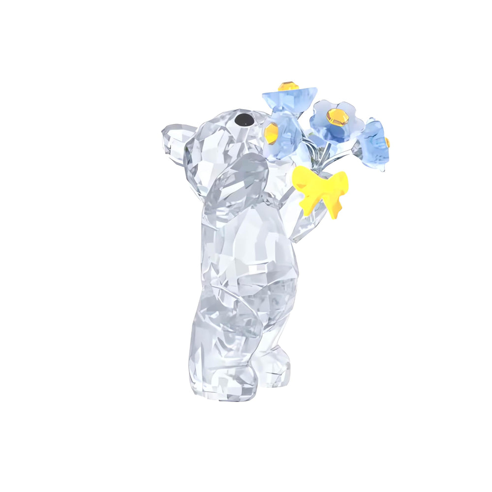 Swarovski Kris Bear gros plan sur fleurs Forget‑Me‑Not et couleurs délicates