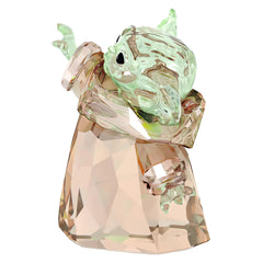 Swarovski The Child gros plan sur facettes teal et dorées, reflet intense