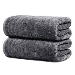 Tens Towels drap de bain plié gris foncé montrant finition et gain de place