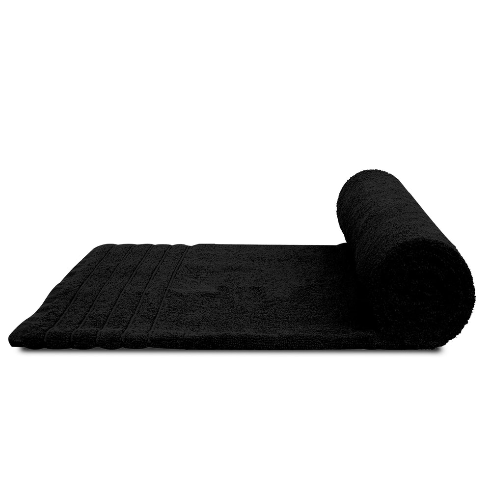Tens Towels lot empilé sur étagère salle de bain style minimal et pratique