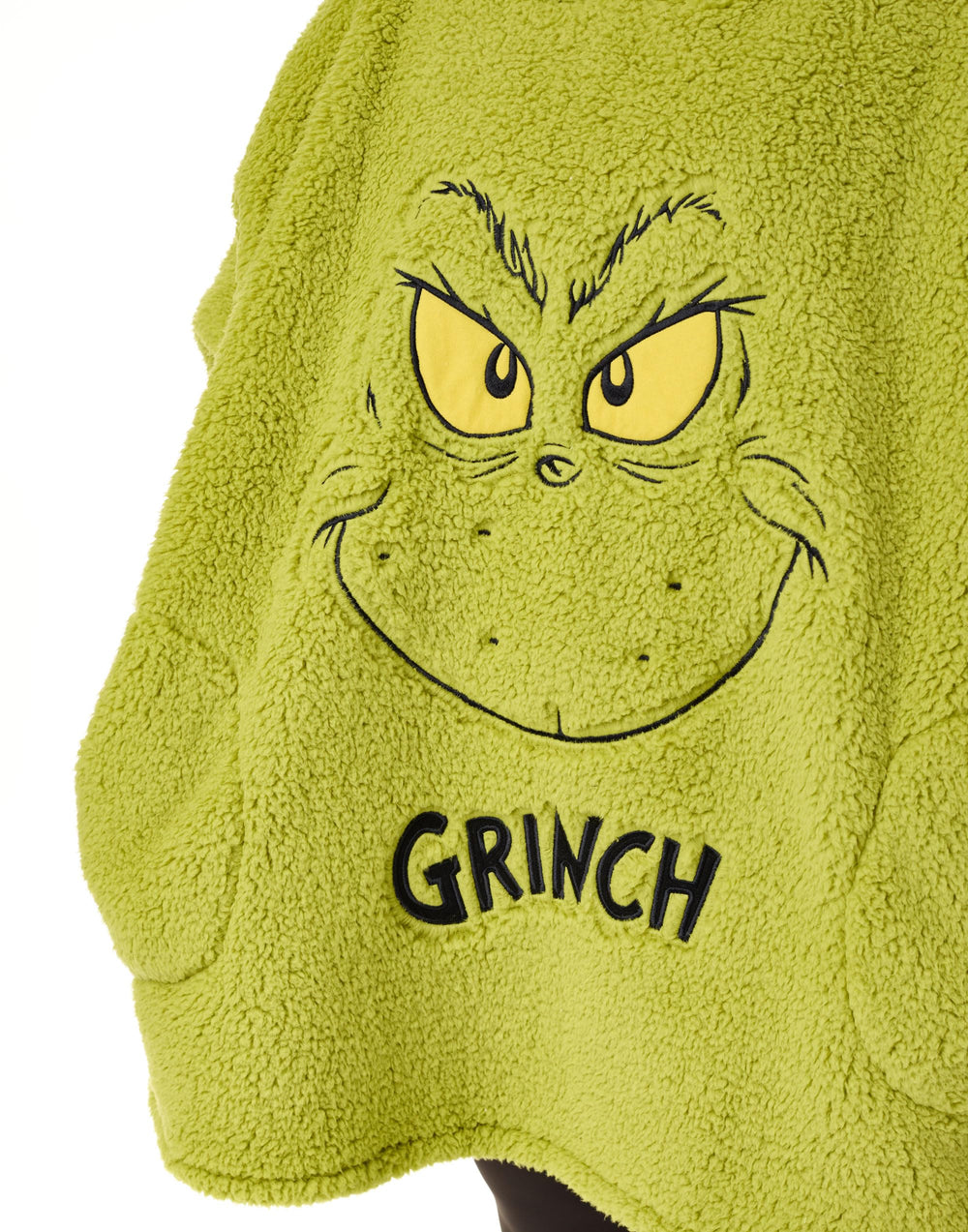 The Grinch porté sur un canapé pour soirées confortables