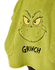 The Grinch porté sur un canapé pour soirées confortables