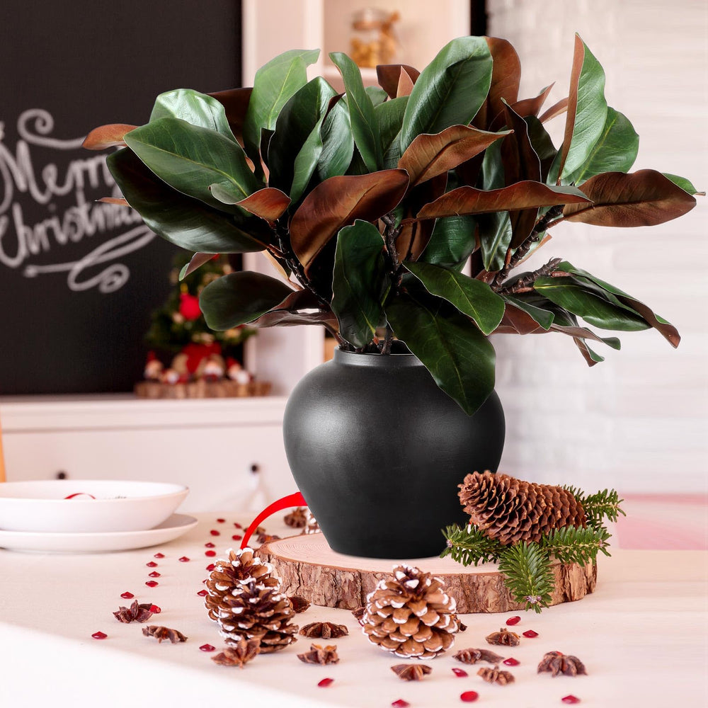 Thiccywoov branches magnolia intégrées à une table de fête, apporte élégance naturelle