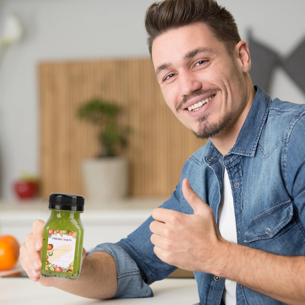 TOMNK bouteille tenue en main montrant échelle et portabilité